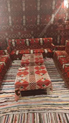 a large room with couches and a rug at vision suites Arbia Hurghada in Hurghada