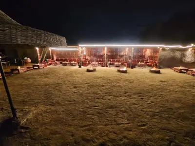 a group of tables in a field at night at vision suites Arbia Hurghada in Hurghada