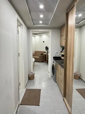 a hallway with a kitchen and a living room at Scandic resort private beach in Hurghada