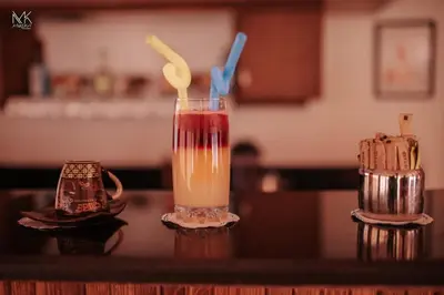 a drink sitting on a counter with two cups at Jamaica Dream in Luxor