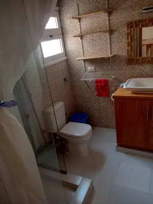 a bathroom with a toilet and a sink at City centre Carrefour in Hurghada