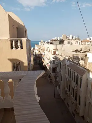 a view of a city street with white buildings at City centre Carrefour in Hurghada