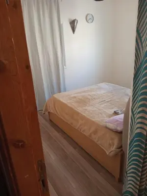 a small bedroom with a bed in a room at City centre Carrefour in Hurghada