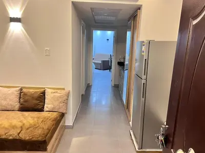 a living room with a couch and a hallway at Scandic resort private beach in Hurghada