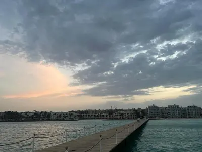a long pier in the middle of a body of water at Scandic resort private beach in Hurghada