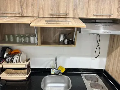a kitchen with a sink and a counter top at Scandic resort private beach in Hurghada