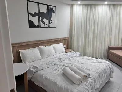 a bedroom with a bed with two towels on it at Scandic resort private beach in Hurghada