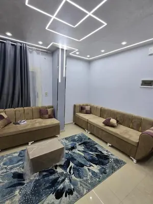 a living room with two couches and a rug at شقة لاروز الغردقه الكوثر القديم شارع النور عماره لاروز in Hurghada