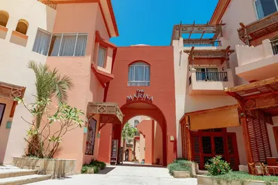 an alley in a building with an archway at The Kaktus Somabay in Hurghada