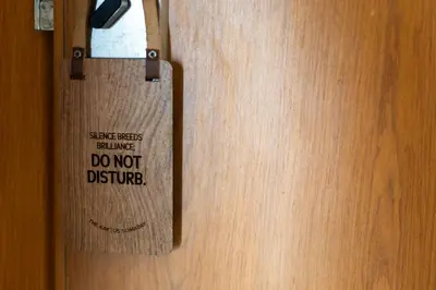 a wooden door with a sign on it that says do not disturb at The Kaktus Somabay in Hurghada