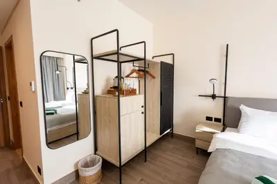 a bedroom with two mirrors and a bed at The Kaktus Somabay in Hurghada
