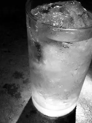 a glass of water sitting on a table at Lucky in Luxor