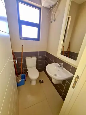 a bathroom with a toilet and a sink at Gouna -tawila in Hurghada