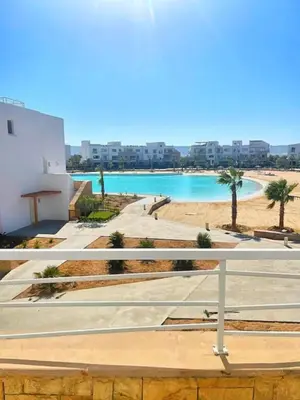 a view of a swimming pool from a building at Spacious 2 BD with crystal Lagoon access in Gouna in Hurghada