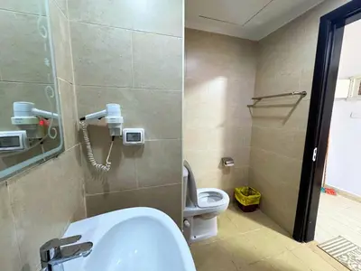 a bathroom with a sink and a toilet at ALDAU LaLa in Hurghada