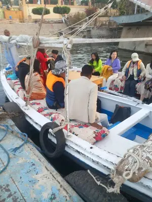 a group of people sitting on a boat in the water at فلوكة نيلية in Luxor