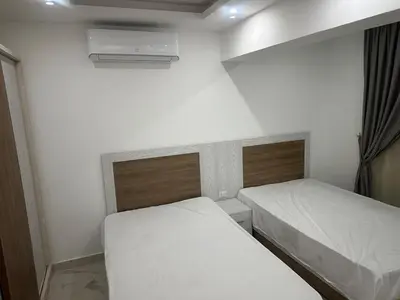 a small room with two beds in it at Sea view chalet hurghada in Hurghada