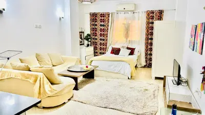a living room with a couch and a table at Boho Oasis - Studio Hurghada Red Sea in Hurghada