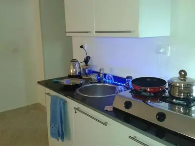 a kitchen counter with a sink and a stove at Boho Oasis - Studio Hurghada Red Sea in Hurghada