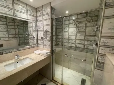 a bathroom with a glass shower and a sink at El gouna mangroovy M3-3D-01 ground floor in Hurghada