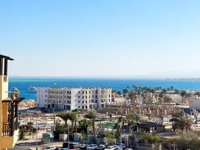 a view of a city with buildings and the ocean at Apartment Aldau in Hurghada