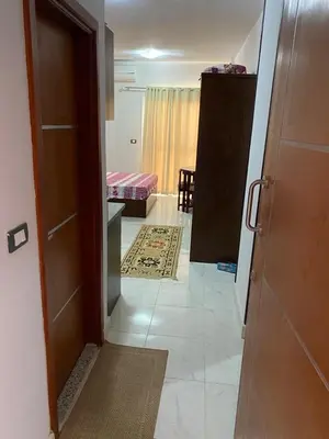an open door to a room with a bedroom at Taiba View Studio in Hurghada
