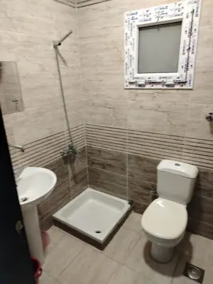 a bathroom with a toilet and a sink at Hurghada Fiesta Resort Studio 232 Beach in Hurghada