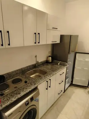 a kitchen with a sink and a washing machine at Hurghada Fiesta Resort Studio 232 Beach in Hurghada
