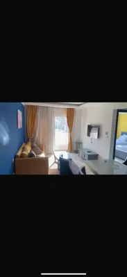 a living room with a couch and a table at 1 bedroom apartment hurghada in Hurghada