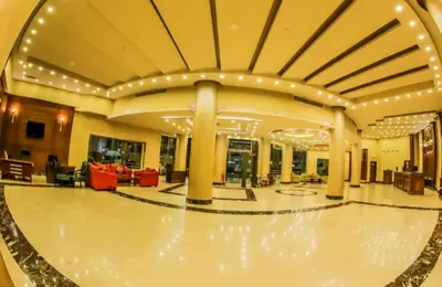 a large lobby with a ball court in the middle at Minaland Beach Resort & Aquapark in Hurghada