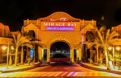 a entrance to a mireggie bay at night at Minaland Beach Resort & Aquapark in Hurghada