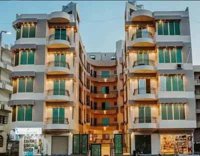 a building with balconies on the side of it at Beachfront Studio Hurghada in Hurghada
