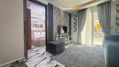 a bedroom with a bed and a television in a room at Hurghada HUB Resort in Hurghada