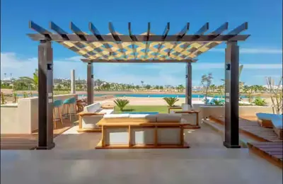 a pergola on the roof of a house at Serene Lakeview Escape 2BR at Cyan ElGouna in Hurghada