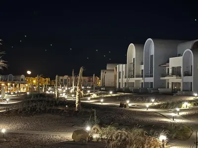 a city at night with lights in front of a building at Kamaran El Gouna - 1 bed ground in Hurghada