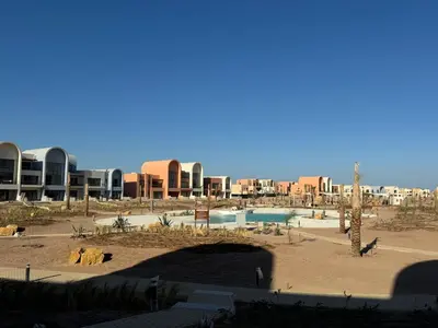 a view of a resort with a pool and buildings at Kamaran El Gouna - 1 bed ground in Hurghada