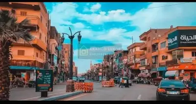 a city street with cars driving down the street at الاقصر امتداد ش التليفزيون in Luxor