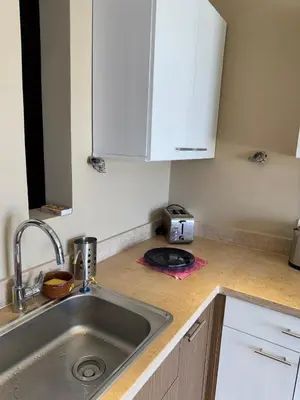 a kitchen counter with a sink and a toaster at Hurghada Apartment Makadi Lagon & Swimming Pools Free in Hurghada