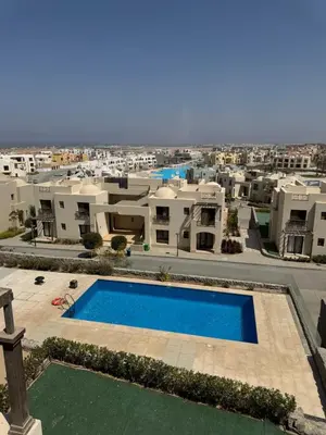 an aerial view of a villa with a swimming pool at Hurghada Apartment Makadi Lagon & Swimming Pools Free in Hurghada