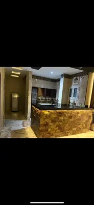 a kitchen with a stone counter top in a room at Nile palace apartment in Luxor