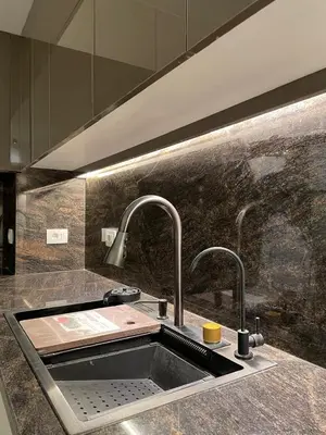 a kitchen sink with two faucets on a counter at Luxurious 3Bd Living Awaits in El Gouna in Hurghada