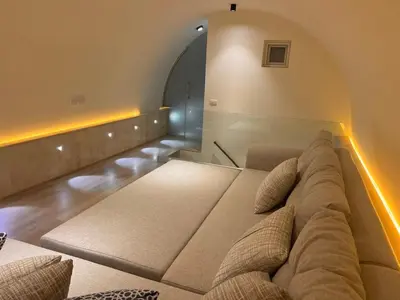 a large couch in a living room with an arch at Luxurious 3Bd Living Awaits in El Gouna in Hurghada