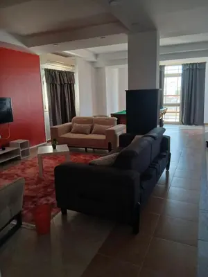 a living room with a couch and a table at Villa yulla in Hurghada