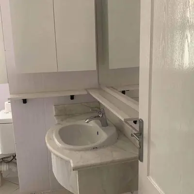 a bathroom with a sink and a white cabinet at West Side B 1 2 in Hurghada
