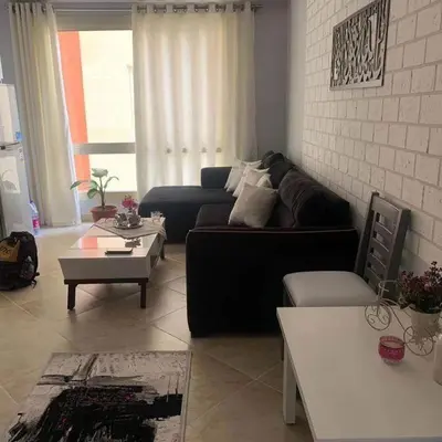 a living room with a couch and a table at West Side B 1 2 in Hurghada