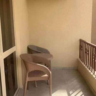 a balcony with a chair and a toilet in a room at West Side B 1 2 in Hurghada