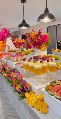 a buffet with many different types of desserts and flowers at The Retreat in Hurghada