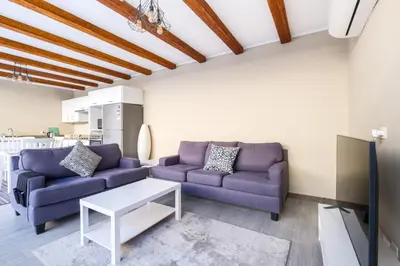 a living room with two purple couches and a table at Luxury 2BR Bali • Heated Pool in Hurghada