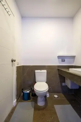a bathroom with a toilet and a sink at Luxury 2BR Bali • Heated Pool in Hurghada