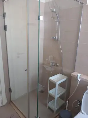 a shower with a glass door in a bathroom at Blue Lagoon View - 2 Bed 2 Bath - Shared Pool - El Gouna in Hurghada